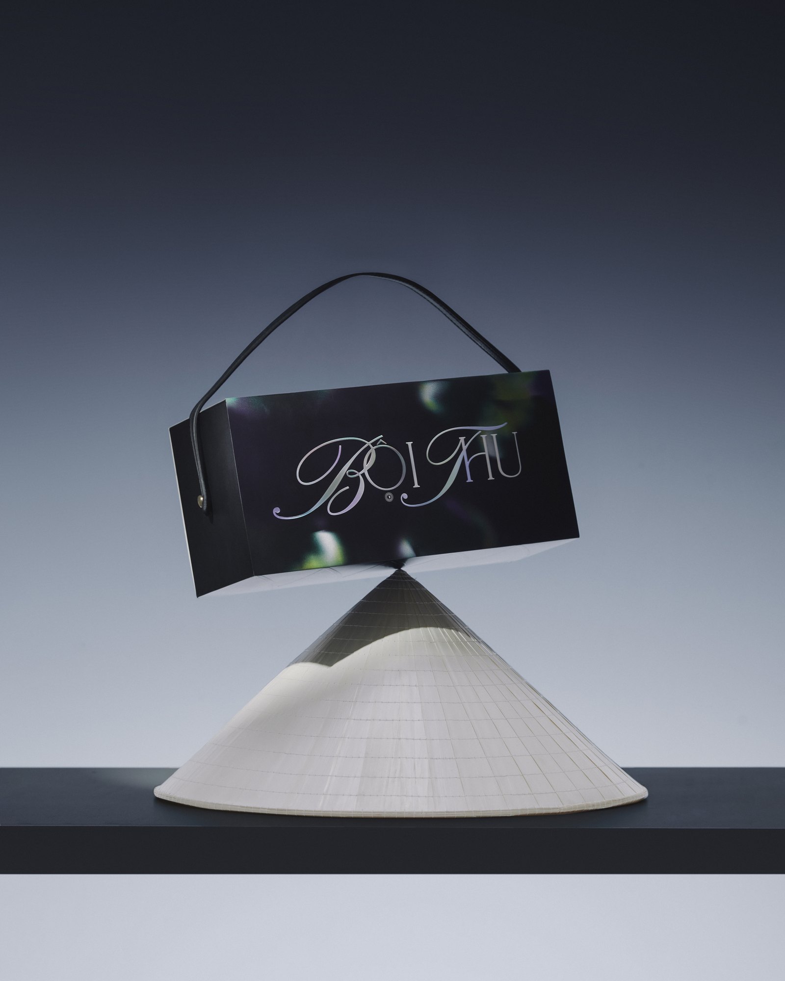 Gift box balanced on a conical hat