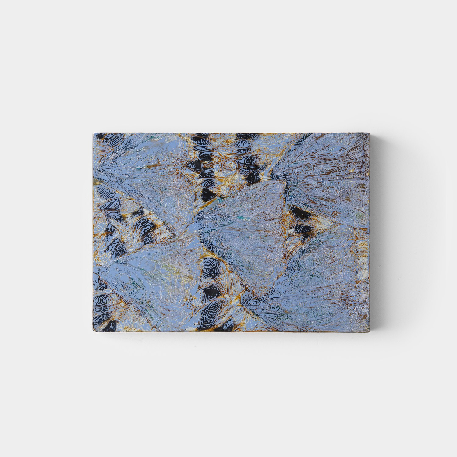 Enamel work in blue and ochre