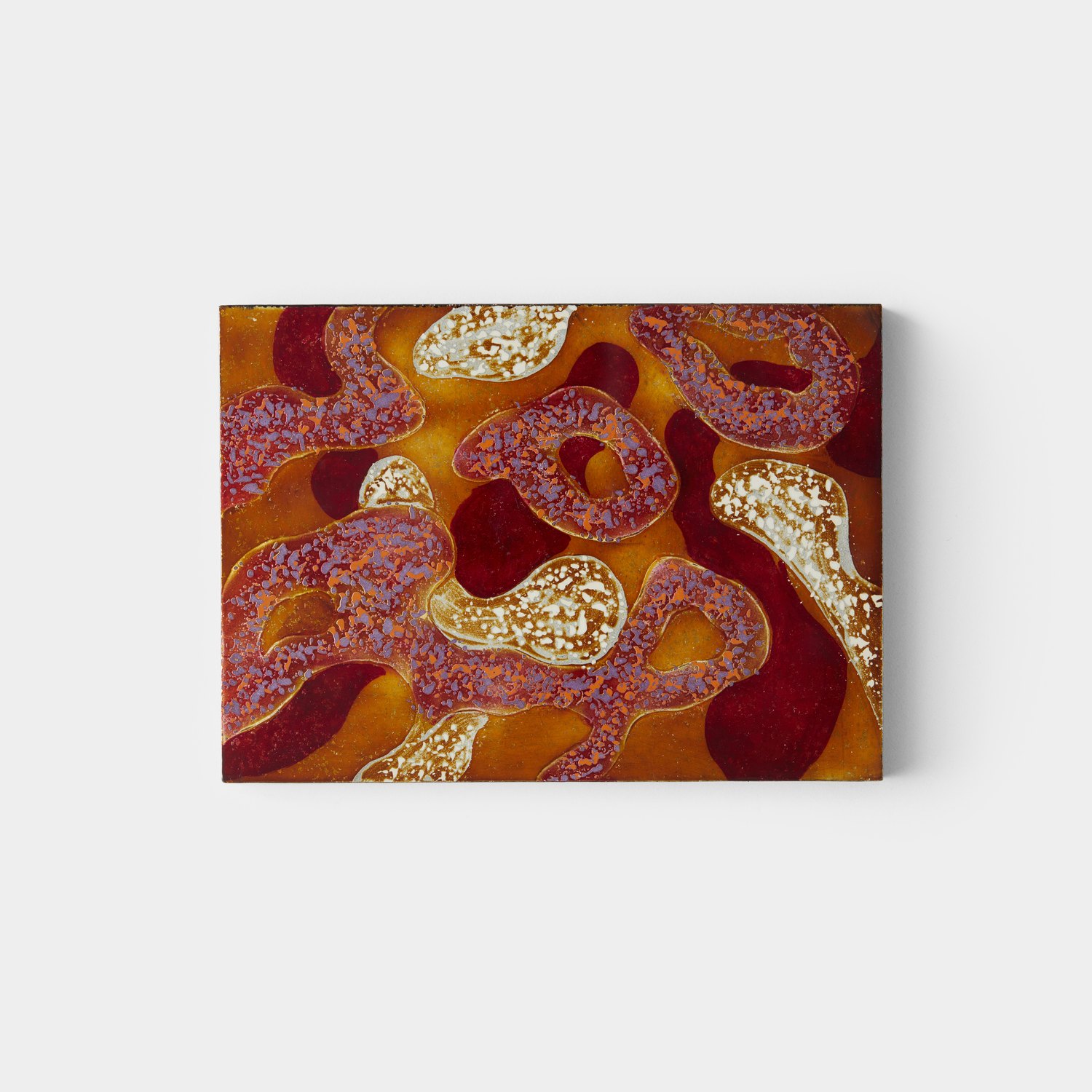 Enamel work in orange and crimson
