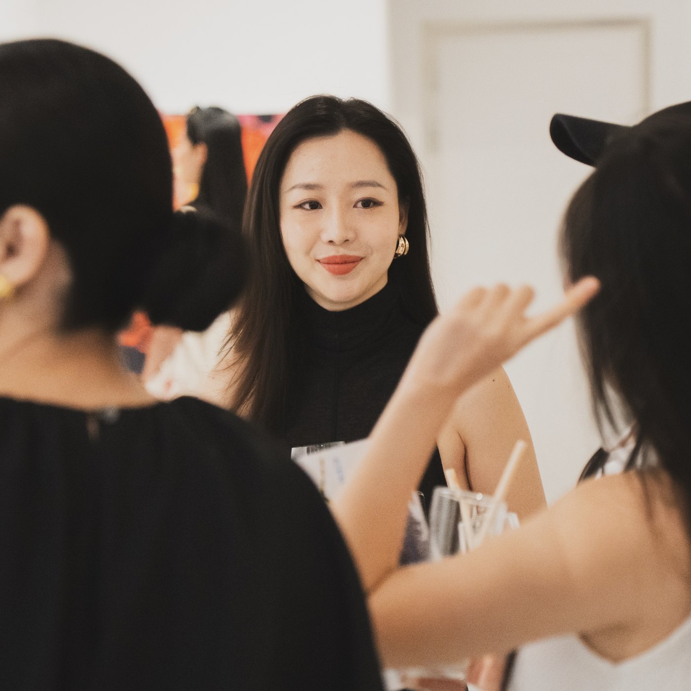 Chloe Hien Nguyen in conversation at a gallery opening